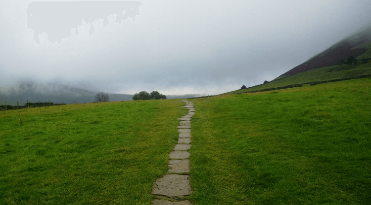 Flagstones lead through dense mist on the Pennine Way